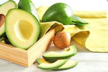 Fresh sliced avocado on table