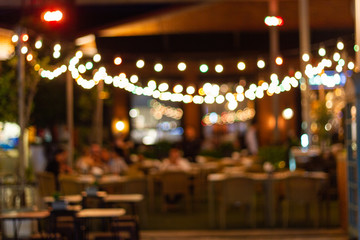 Fototapeta na wymiar abstract blur image of night festival in a restaurant and The atmosphere is happy and relaxing with bokeh for background, Bangkok Thailand.