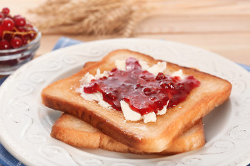 Tasty toasts with sweet jam on plate, closeup