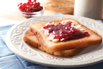 Tasty toasts with sweet jam on plate, closeup