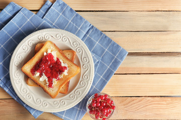 Tasty toasts with sweet jam on plate