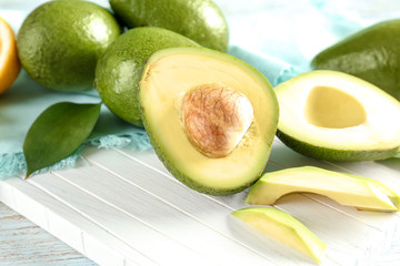 Ripe avocados on wooden background