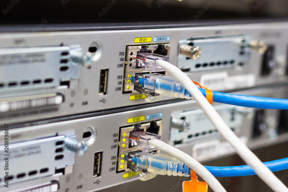 Poster network switch in rack, network cables connect sfp module port in the datacenter room, concept commu