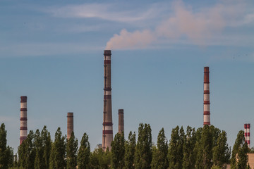 Obraz premium industrial pipes and smoke