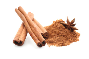 Cinnamon sticks and powder on white background