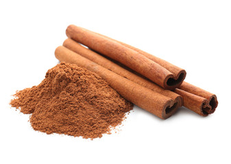 Cinnamon sticks and powder on white background