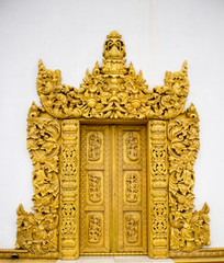 wooden golden color carving door