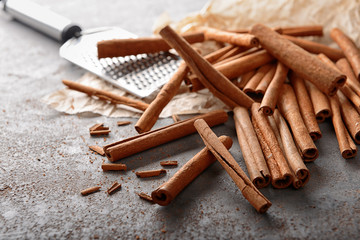 Cinnamon sticks on grey background