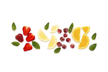 Colorful bright fruit, strawberry, cherry, lemon, orange, mint leaves on a white background light. Flat lay, top view