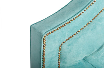 Elements of the design of the soft back of the bed with a dented cloth. Furniture, house, decor.