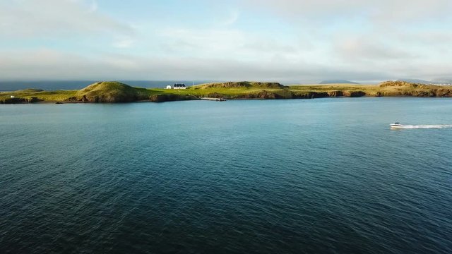 Iceland Reykjavik ocean nature and small house on the island with pier. Top view. Aerial video footage bird's-eye view