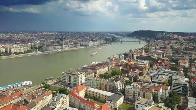 Budapest, Hungary - 4K Aerial skyline view of centre of Budapest with Hungarian Parliament, Szechenyi Chain Bridge and cruise ship on River Danube