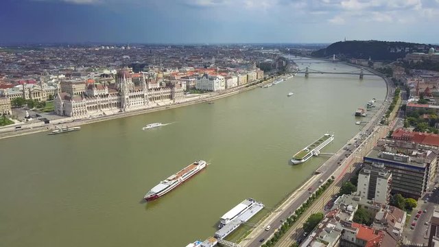 Budapest, Hungary - 4K Aerial skyline view of centre of Budapest with Hungarian Parliament, Szechenyi Chain Bridge and cruise ship on River Danube