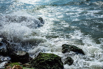 Waves breaking, Waves splashing on stony beach, Thailand