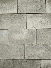 Concrete tiles wall texture background. Vertical photo.