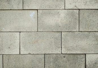 Concrete tiles wall texture background. Vertical photo.