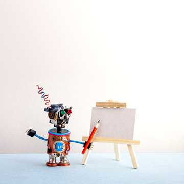 Kindly robot artist begins to create a drawing with a pencil. White paper template, wooden easel. Advertising poster studio school of visual arts. copy space.