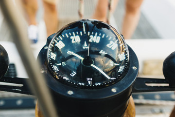 sailing boat pilot following the compass