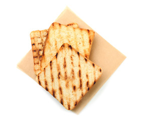 Tasty toasted bread on white background