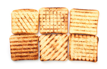 Tasty toasted bread on white background, top view