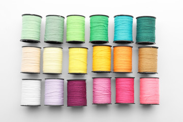 Set of sewing threads on white background