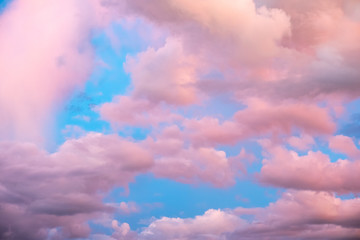 Colorful pink clouds in blue sky