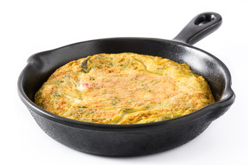 Frittata made of eggs and vegetables in a iron pan, isolated on white background

