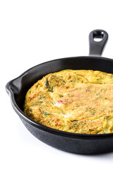 Frittata made of eggs and vegetables in a iron pan, isolated on white background

