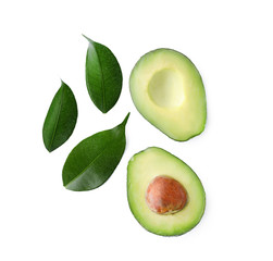 Halves of fresh avocado on white background, flat lay