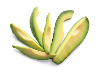 Slices of ripe avocado on white background