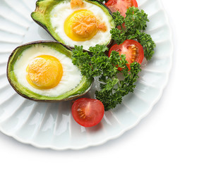 Baked avocado with eggs on white background