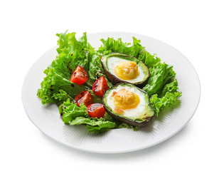 Baked avocado with eggs and vegetables on white background