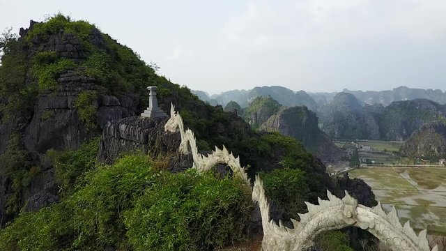 Lying Dragon Statue Atop Mountain Aerial
