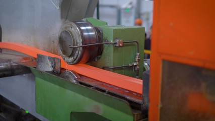 In the frame, red-hot metal on the rental line. The section of the future rolling is formed successively by special rollers.