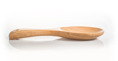 Side view of wood spoon on white background