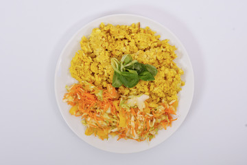 Baked Bulgar with cauliflower and vegetable salad on a white