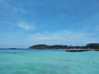 Many boat park on the blue sea