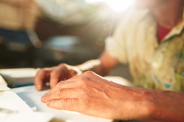 Close up man working of Architect sketching a construction project on his plane project at site construction work