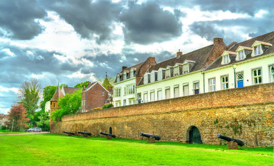 Fototapeta na wymiar Medieval city wall with cannons in Maastricht, the Netherlands