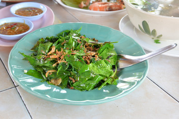 Stir fried local vegetables (Melinjo leaves) with shrimp, Phang nga, Thailand
