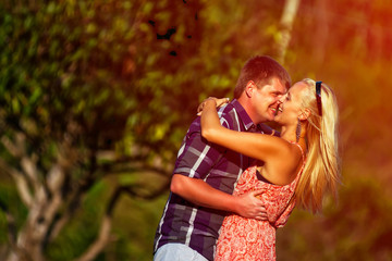 young couple kissing in the tropics on a hot summer day