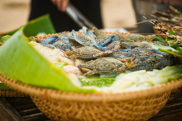 Fresh blue crabs in the basket on the seafood market in Vietnam