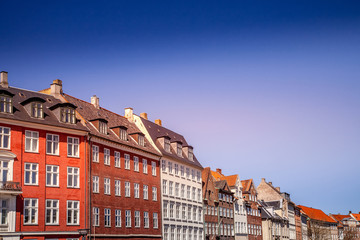 Fototapeta na wymiar Urban scene with colorful buildings and clear blue sky in Copenhagen, denmark