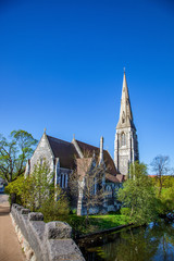 calm pond near beautiful old church at sunny day, copenhagen, denmark