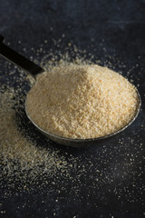 Onion Powder Spilled from a Teaspoon