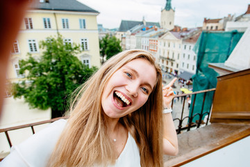 Portrait of wonderful white blond woman model expressing energy in good day in Europe. Lovely...