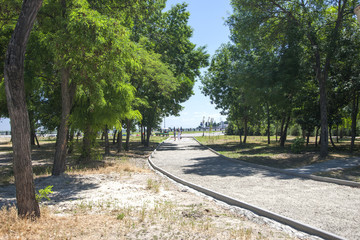 The park alley. The background is blurred Image of Abstract blur road on day time for background usage .