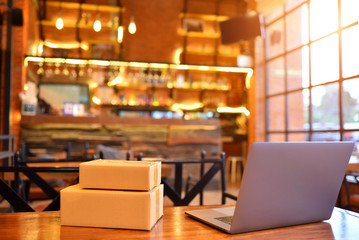 Prepare to ship online at a coffee shop. The box and the product.