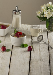 Cottage cheese casserole in white dish decorated with strawberries