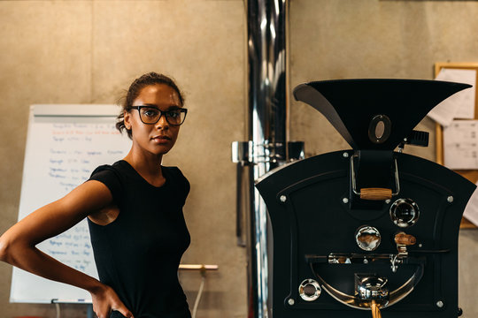 Portrait of a young entrepreneur in her coffee roastery